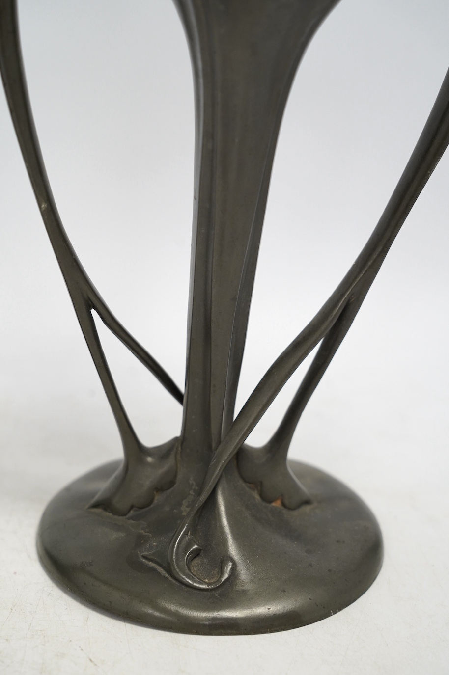 A pair of Art Nouveau Liberty Tudric pewter twin-handled vases, stamped to the bases, 25cm high. Condition - one good, the other poor to fair